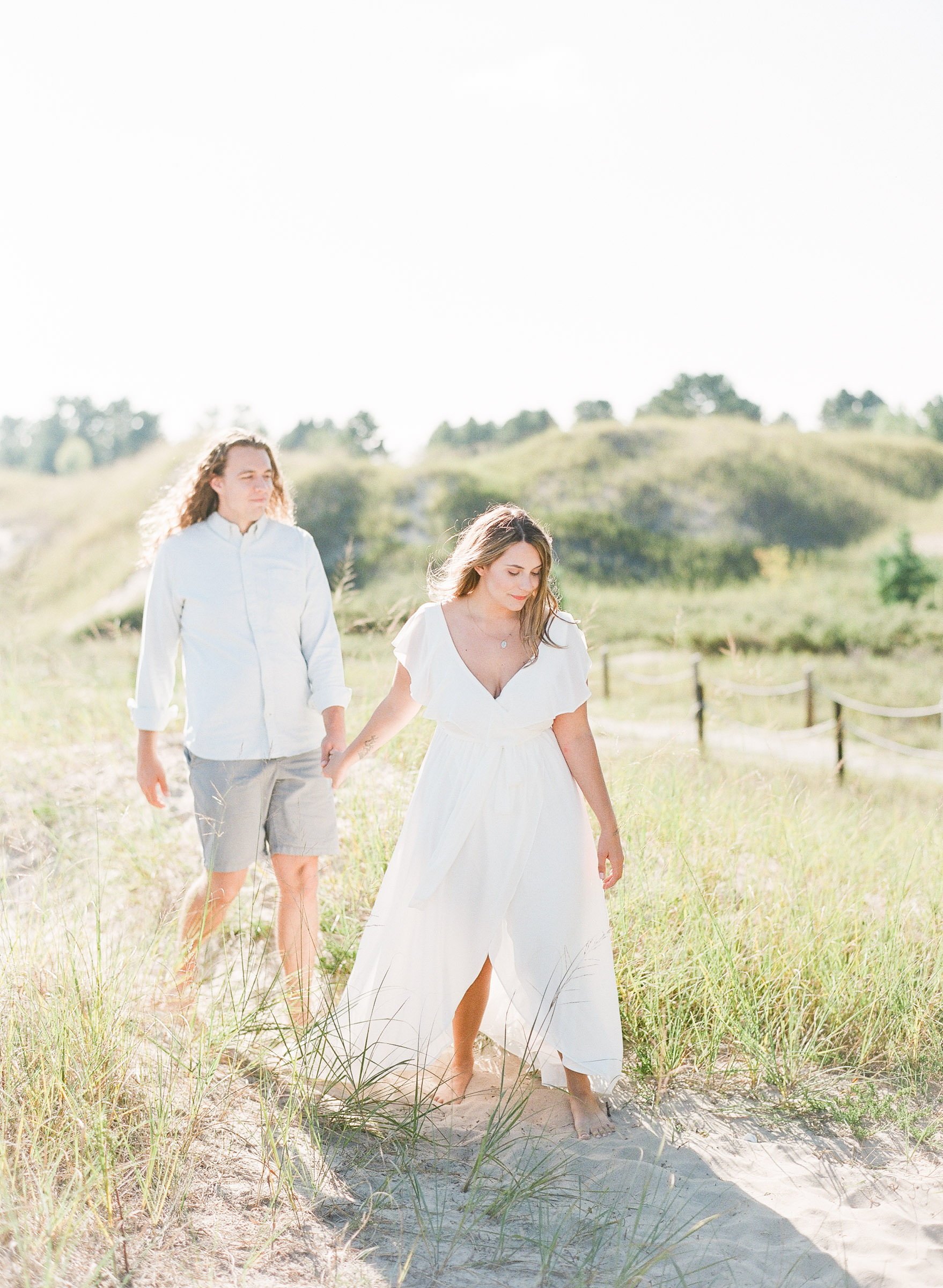 A couple get's their engagement photos done at Kohler Andrae State Park