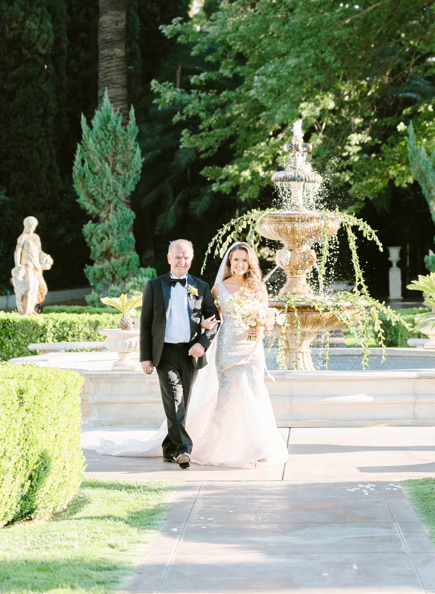 bride and father walks down the aisle for grand island mansion wedding