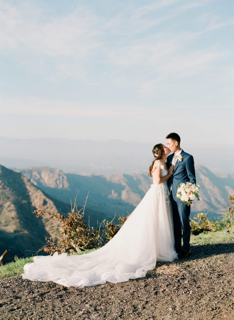 A married couple at their Saddlerock ranch wedding in malibu