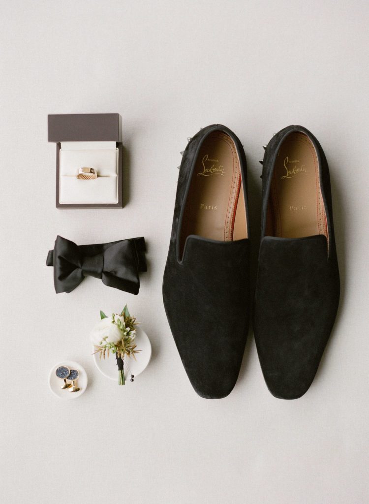 groom wedding details with louboutin loafers in milwaukee